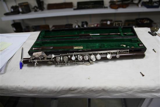 A Rudall Carte & Co. rosewood flute, no. 7340, flute 26.5in.